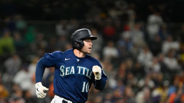Sep 27, 2023; Seattle, Washington, USA; Seattle Mariners left fielder Jarred Kelenic (10) runs towards first base after hitting a single against the Houston Astros during the ninth inning at T-Mobile Park. Mandatory Credit: Steven Bisig-USA TODAY Sports  